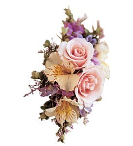 Pink roses with purple and cream flowers in a small bouquet