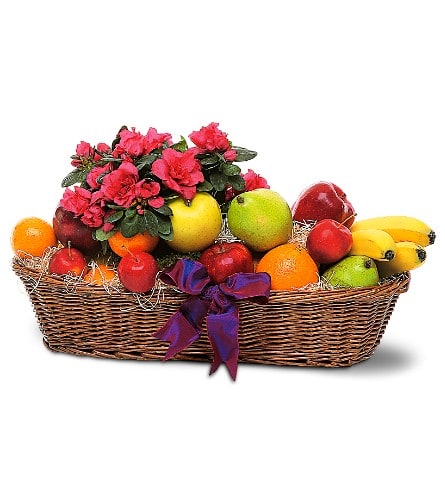 Fruit basket with pink flowers and a purple ribbon