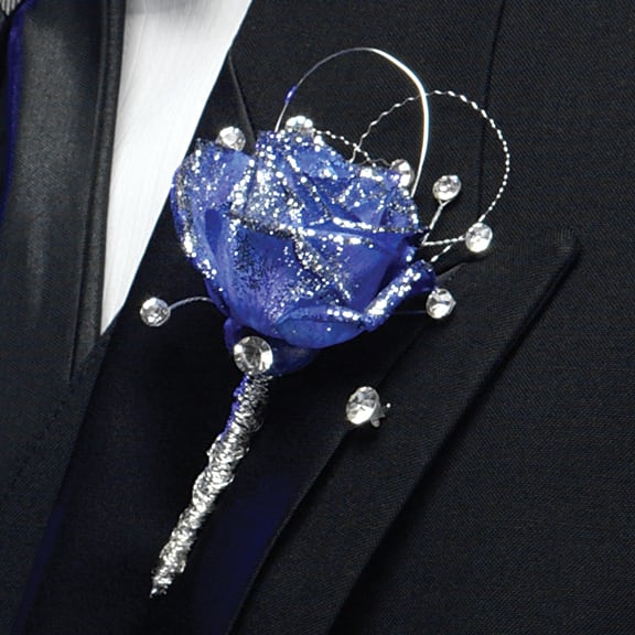 Blue rose boutonniere with rhinestone accents on a suit lapel