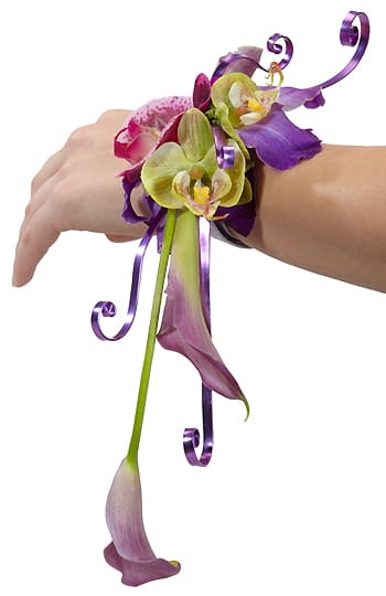 Purple and green orchid wrist corsage with ribbon curls