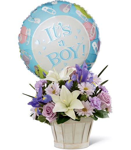 Flower basket with a "It's a Boy!" balloon and pastel blooms