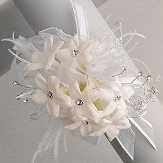 White floral bouquet with ribbon and sparkling accents