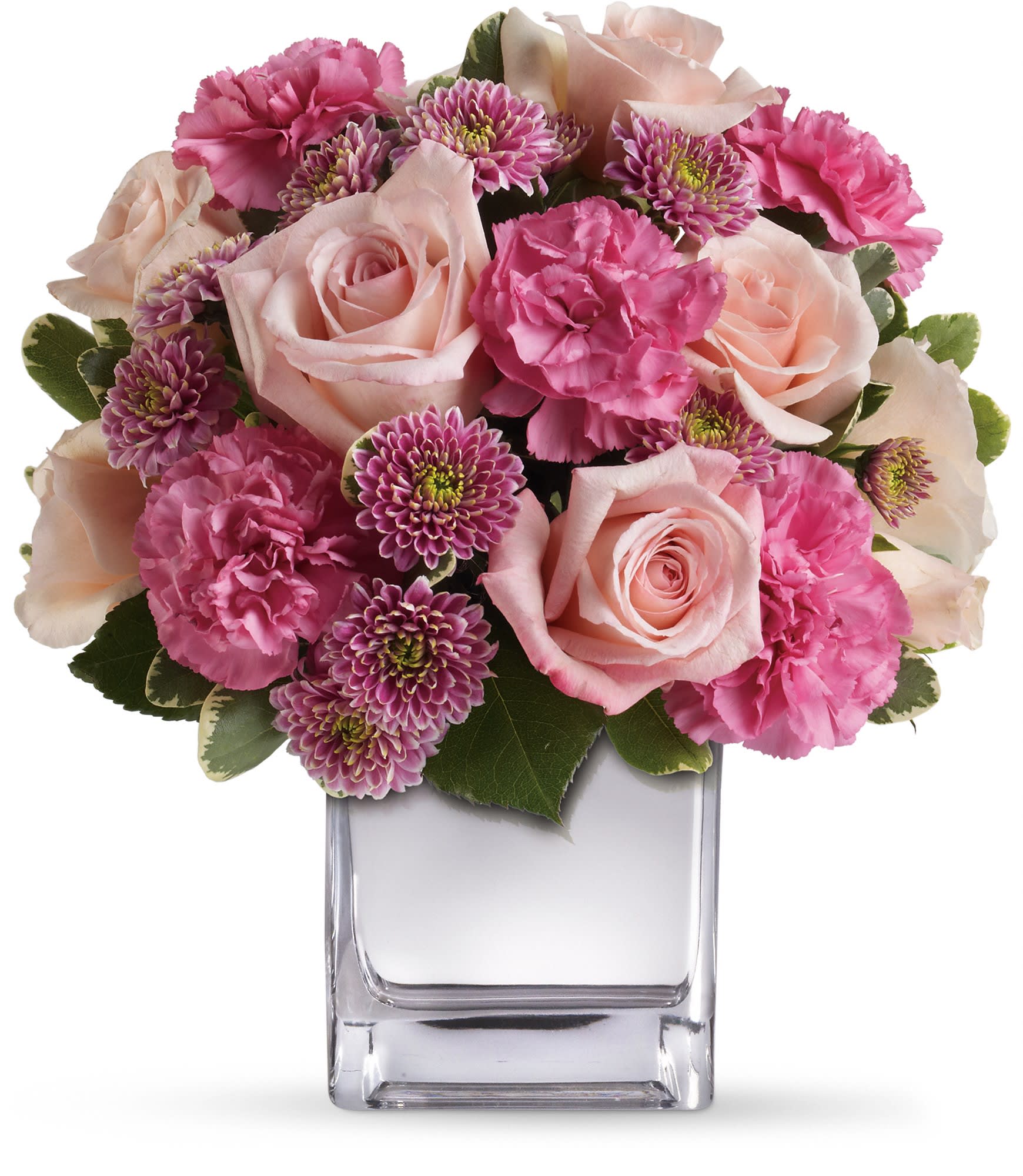 Pink roses and carnations in a clear glass vase