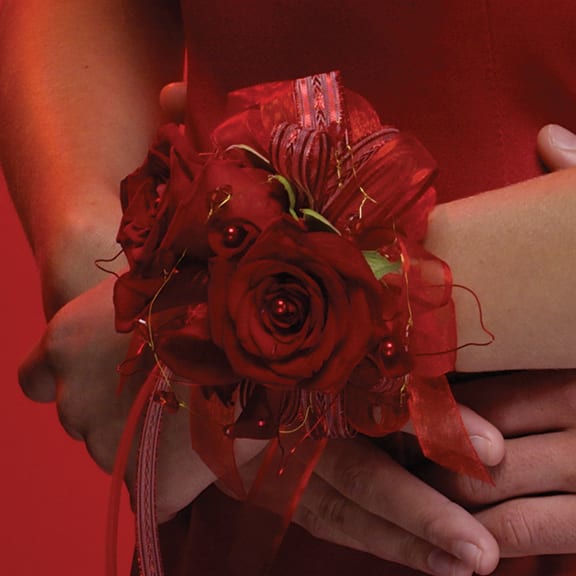 Red rose wrist corsage with ribbon and bead accents