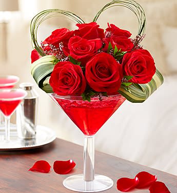 Love Potion - Product ID: BF264-11KM  EXCLUSIVE Raise your glass to romance with the perfect Valentine's âcocktailâ! This fun and flirty arrangementâhandcrafted with red roses, heart-shaped bear grass and more in an oversized martini glassâis a truly original recipe that stirs up smiles for friends, lovers or that special someone you've had your eye on. The freshest premium red roses are hand-designed by our expert florists with bear grass shaped into a heart, pink calcynia, aspidistra leaf and myrtle Crafted in an oversized acrylic martini glass filled with ruby red crystal gel; glass measures 9"H Extra Large arrangement measures approximately 14.5"H x 7.5"L Large arrangement measures approximately 14"H x 7"L Medium arrangement measures approximately 13.5"H x 6.5"L Small arrangement measures approximately 13"H x 6"L Our florists select the freshest flowers available so colors and varieties may vary