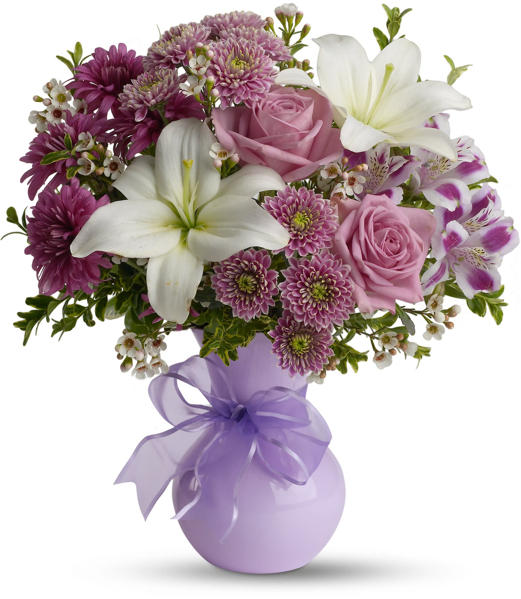 Teleflora's Precious in Purple - If you want to impress someone, send elegant flowers in a soft lavender vase accented with a lavender ribbon. Warm, rich, dramatic, it's the kind of gift that says, "You're special. And so am I." 