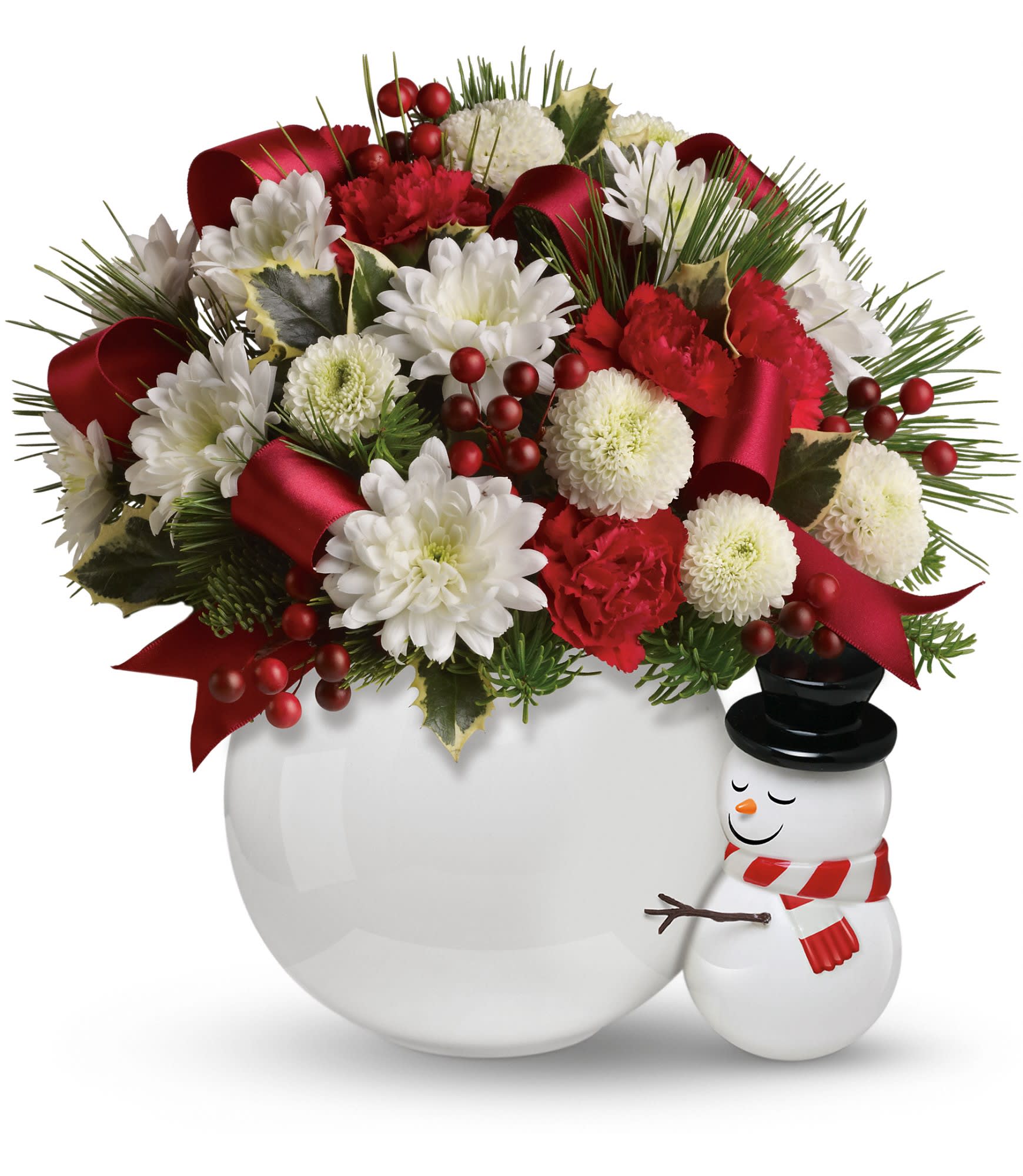 Teleflora's Send a Hug Bouquet - The sweet bouquet includes miniature red carnations, white cushion spray chrysanthemums, white button spray chrysanthemums, noble fir, pine and variegated holly. Delivered in a ceramic snowball vase accompanied by a hand-painted snowman. Approximately 12" W x 11" H. 10X500B