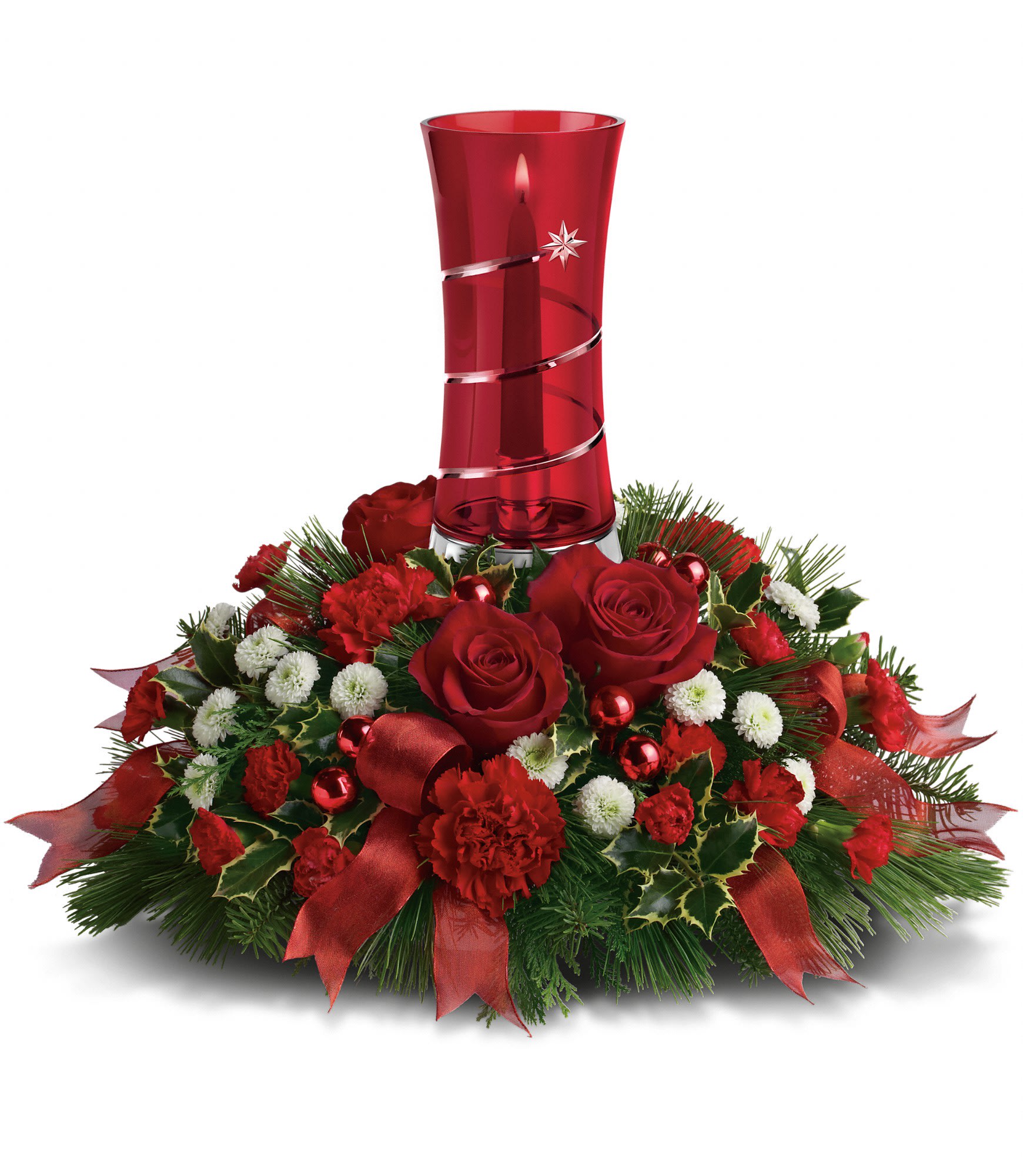 Teleflora's Star Bright Centerpiece - The festive Christmas floral centerpiece includes red roses, red carnations, red miniature carnations, white button spray chrysanthemums, variegated holly, white pine, noble fir and cedar accented with red ribbon. Approximately 20" W x 16" H.  T11X300A  