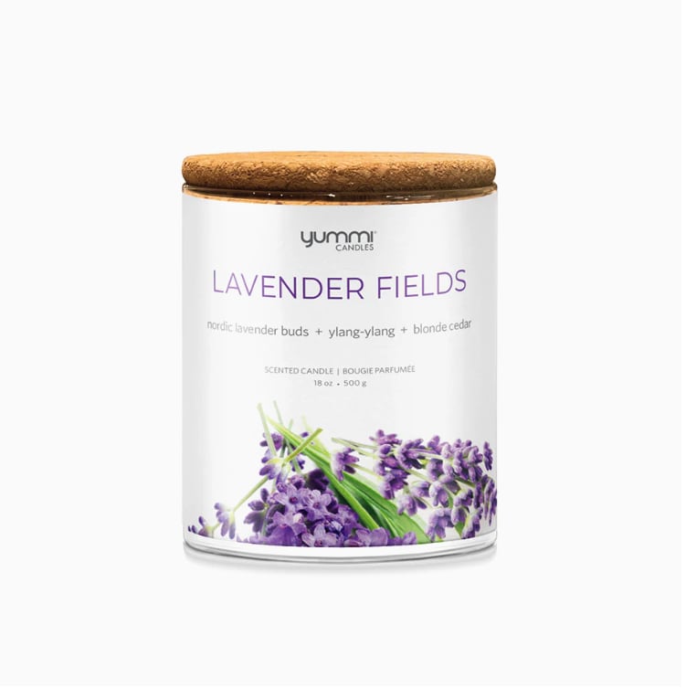 Lavender scented candle in a glass jar with a wooden lid