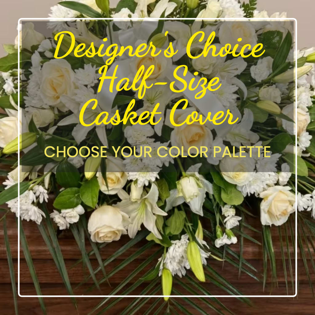White floral casket cover with roses, lilies, and daisies