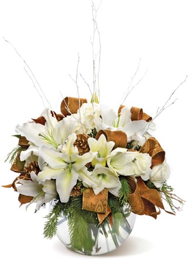 White lilies and roses in a glass vase with copper ribbon accents