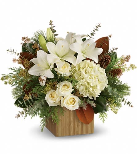 White lilies and roses in a wooden box arrangement