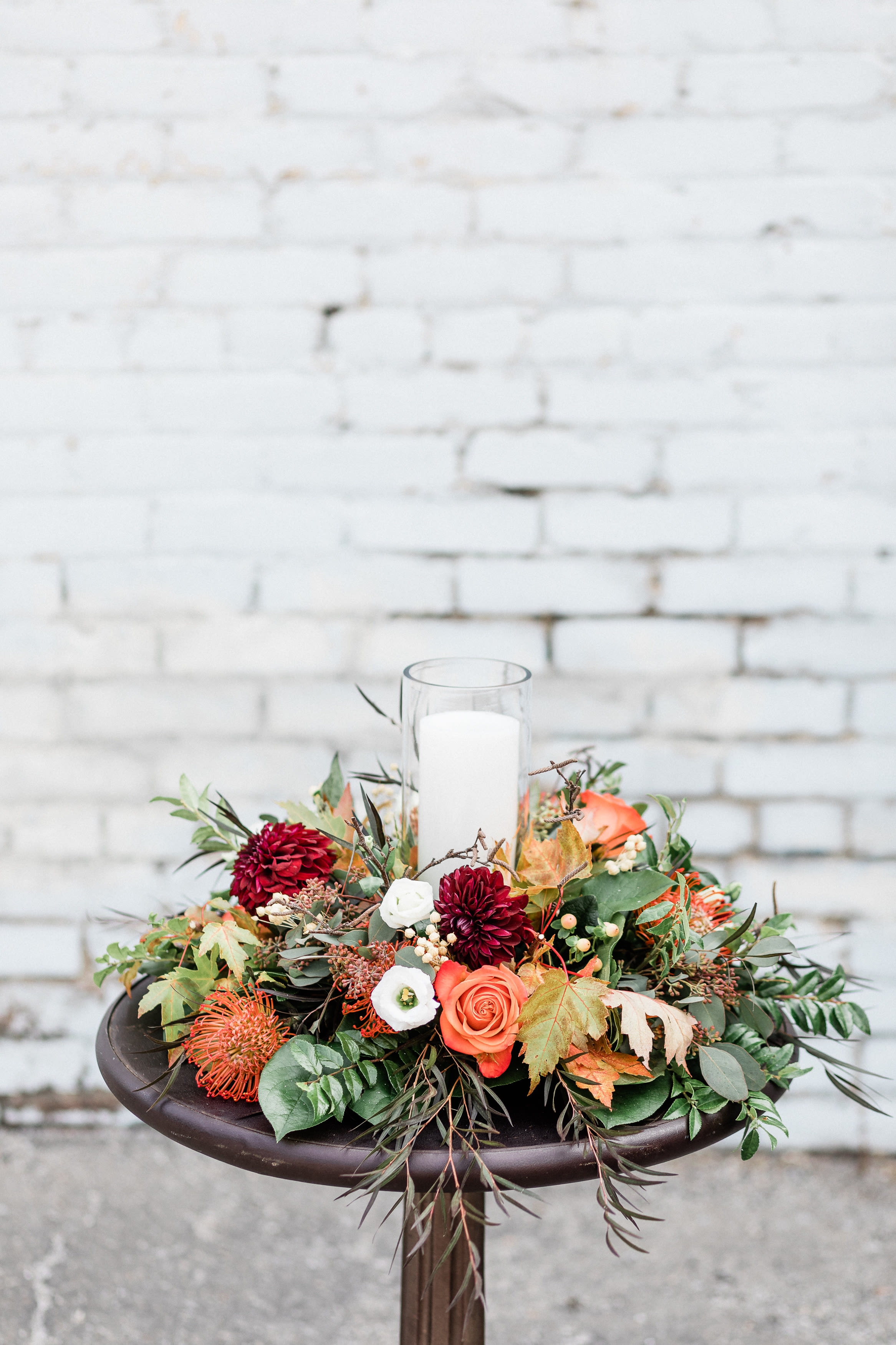 Harvest Dinner Centerpiece - Wow your guests this season with this traditional yet one-of-a-kind floral centerpiece for this year's festivities! Glass shield and candle not included.  pictured [DELUXE]