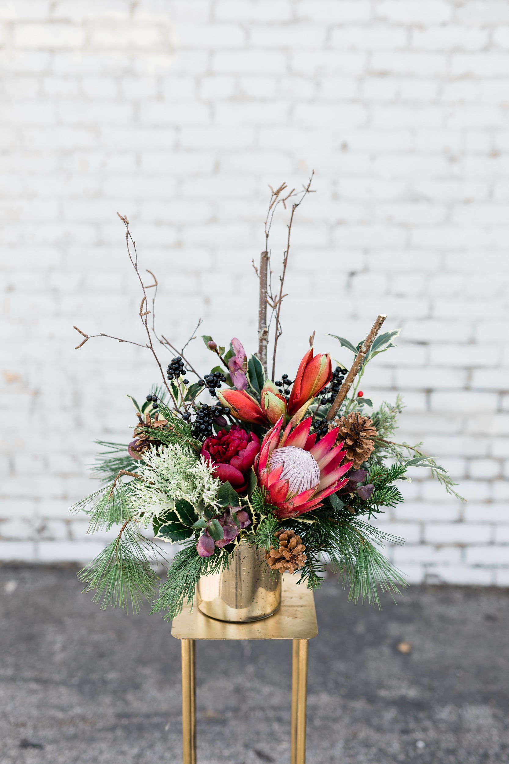 Tropical Urban Christmas - Beautiful mix of hydrangeas, roses, berries and assorted Christmas greens arranged in an urban tin vase. Perfect for the Holiday Season!  Pictured [DELUXE]