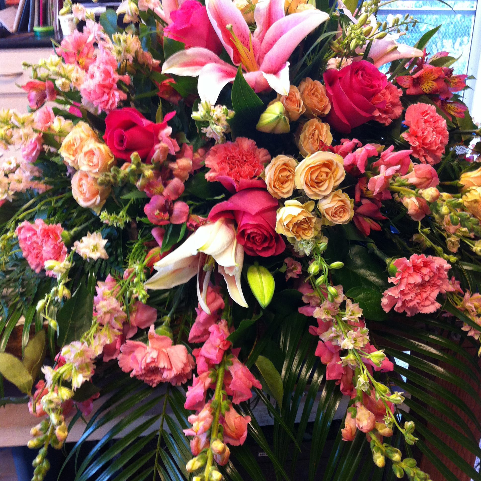 Large mixed bouquet with pink lilies, roses, and carnations