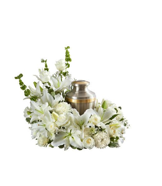 White lily and rose cremation urn wreath with a metal urn in the center