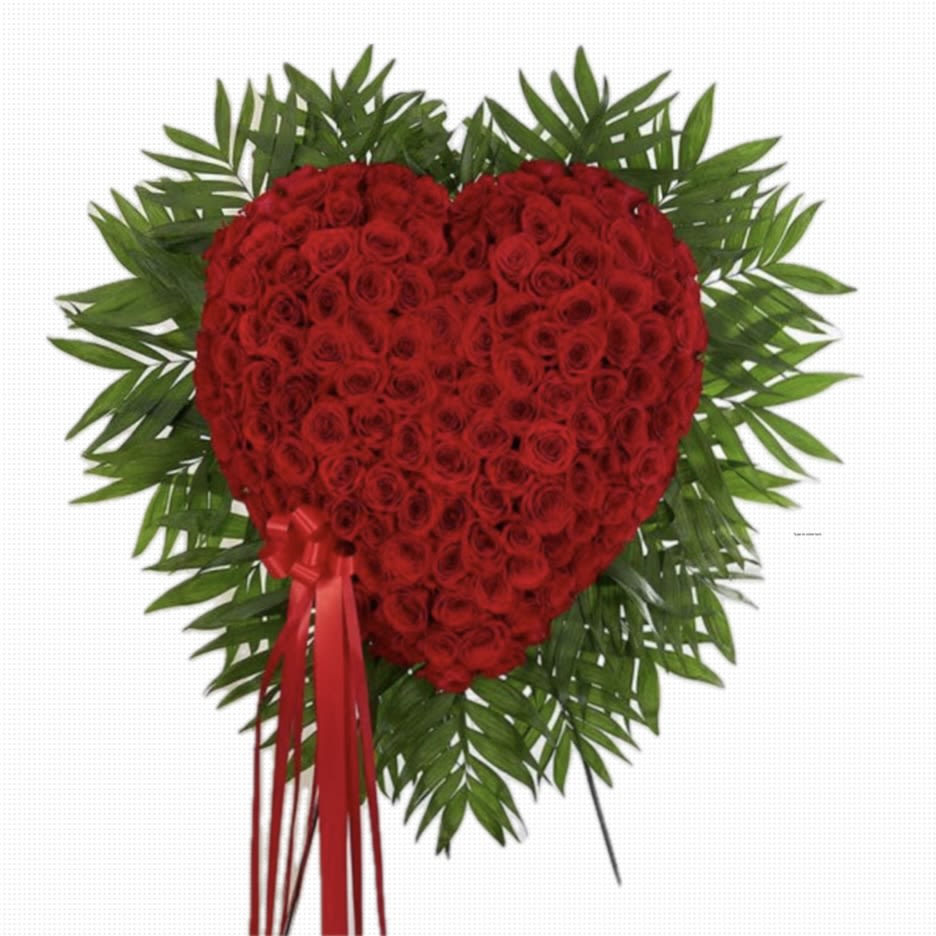 Heart-shaped cluster of red roses framed by radiating green foliage with long red ribbons
