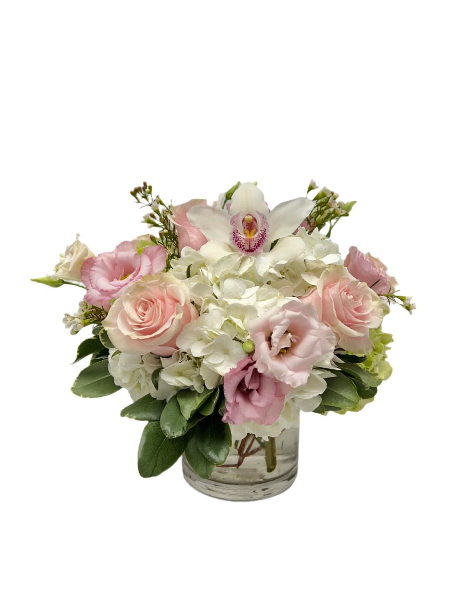 Pink and white bouquet in a clear glass vase
