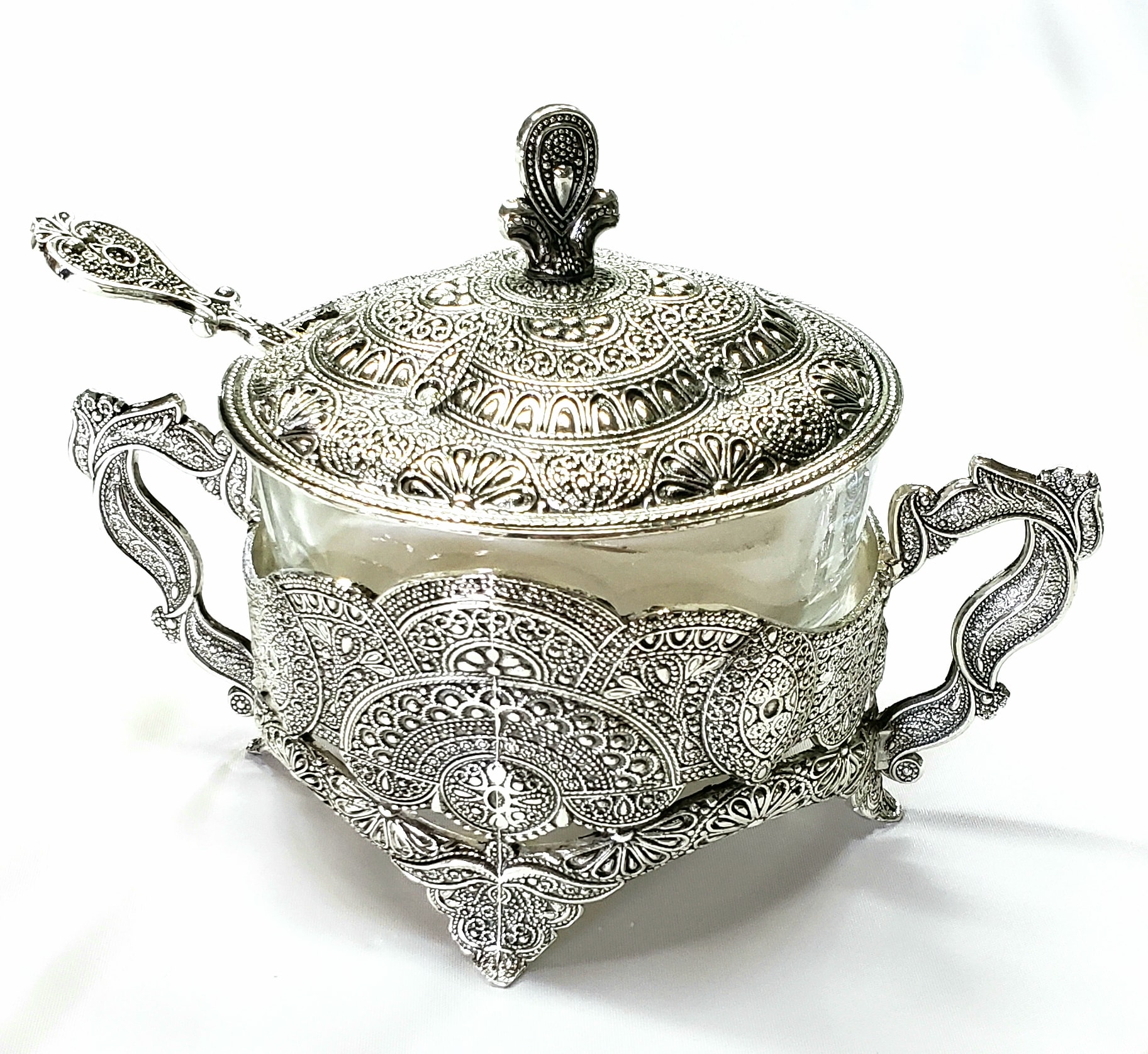 Ornate silver-toned lidded glass bowl with two handles
