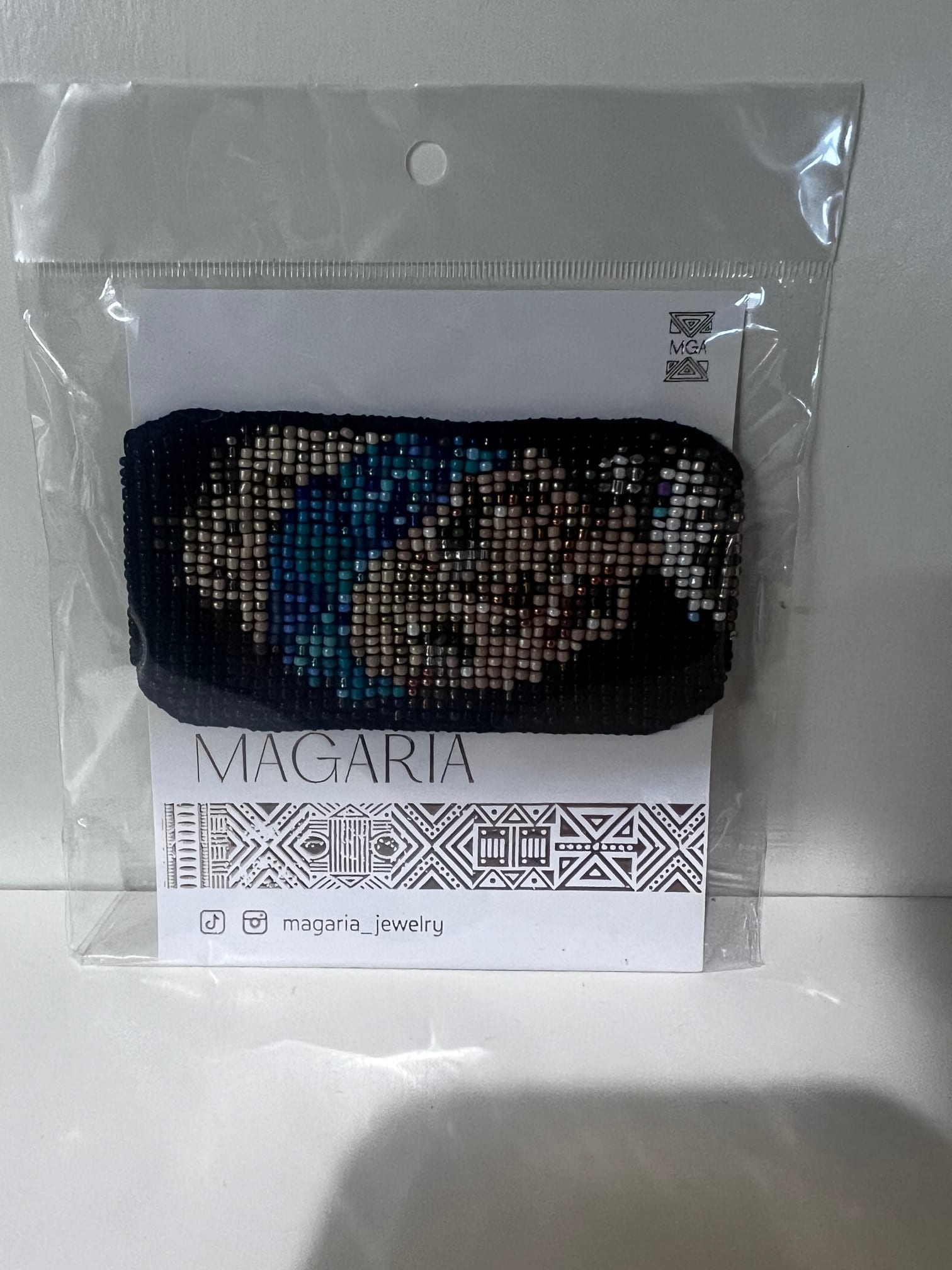 Beaded bracelet in plastic packaging with a Magaria card