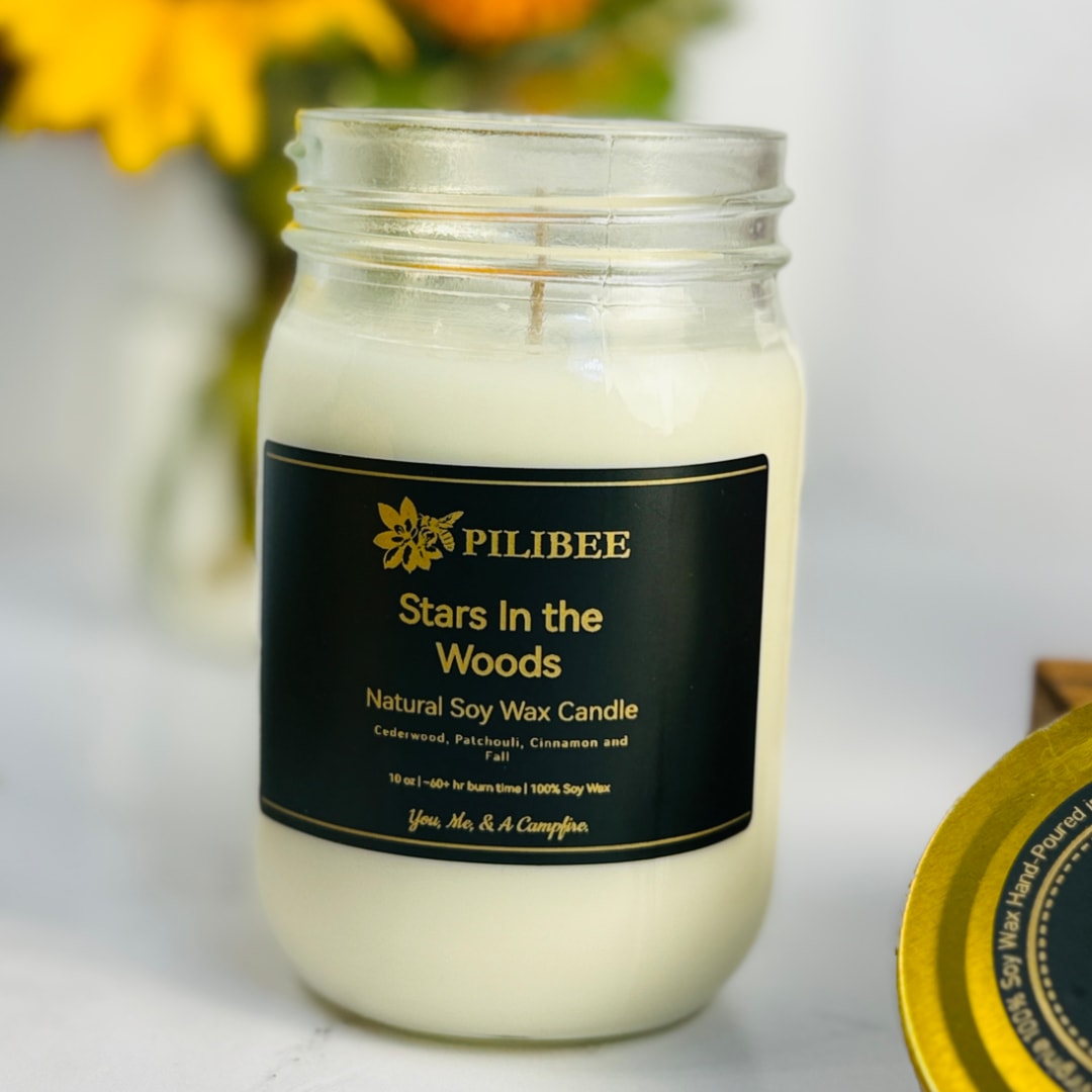 Soy wax candle in a glass jar with a black label