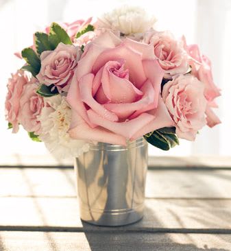 Pink rose bouquet in a silver tin vase
