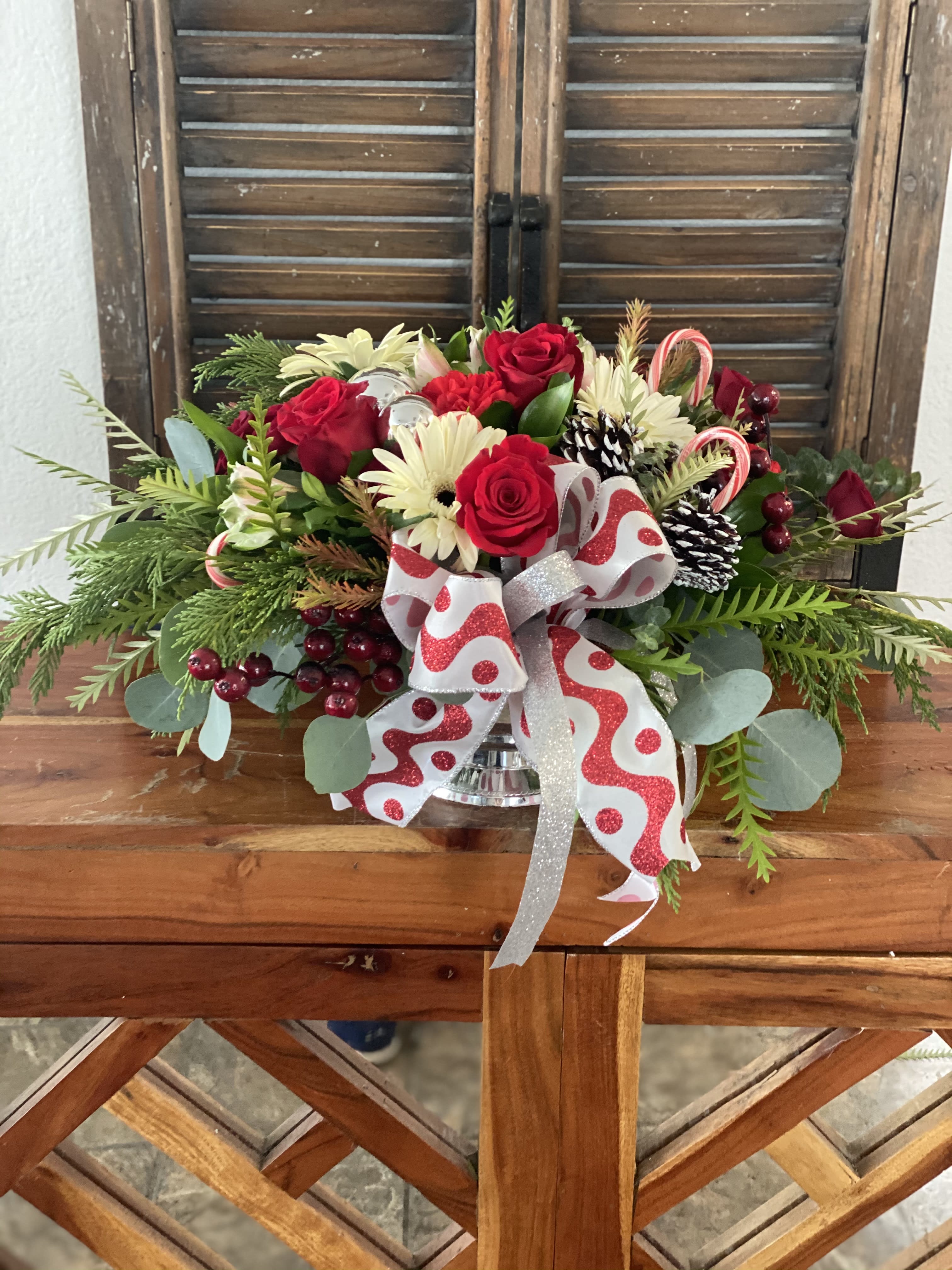 Jolly candy canes  - Silver  plastic vase with holiday flowers combinations with candy canes.