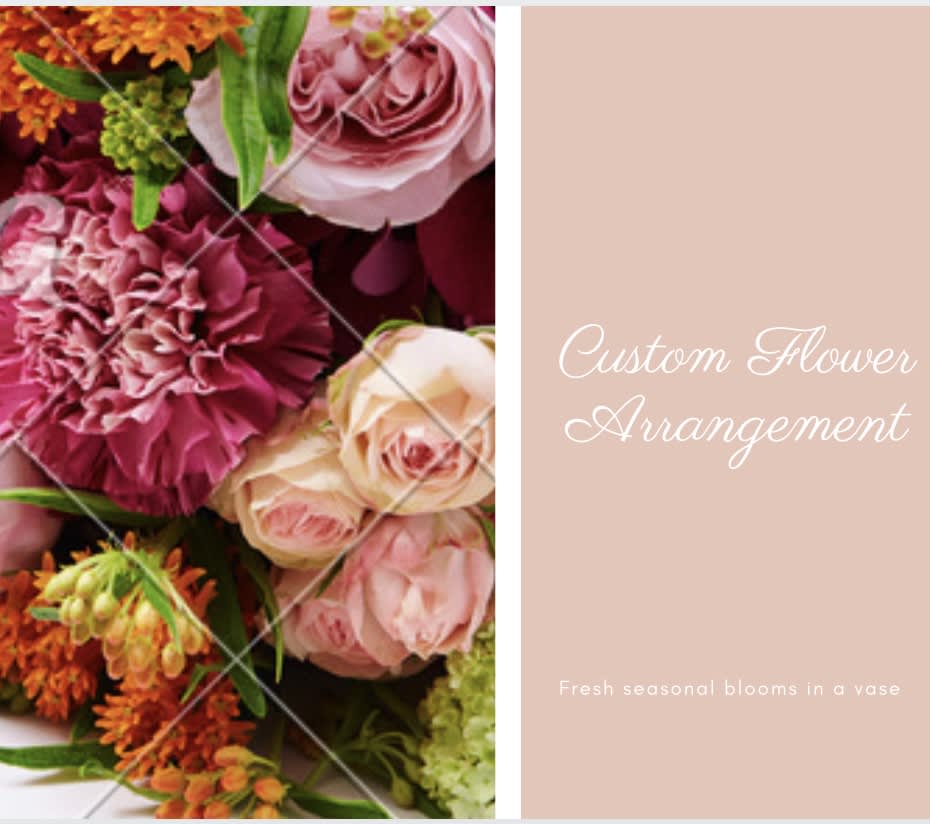 Pink and orange flower arrangement with roses and carnations