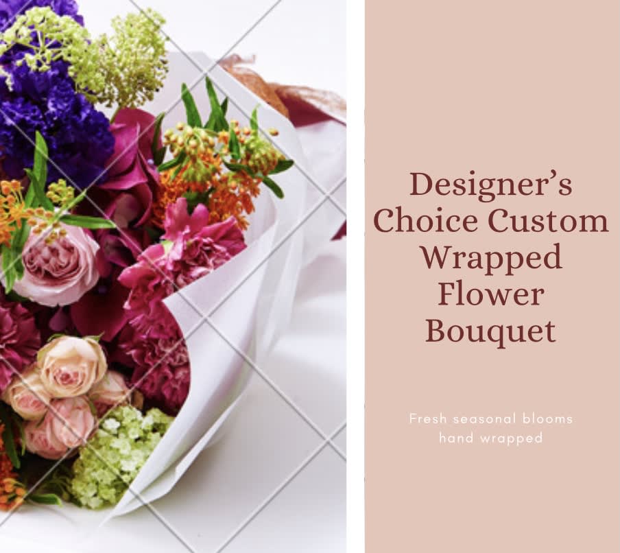 Wrapped bouquet of mixed pink, purple, and orange flowers