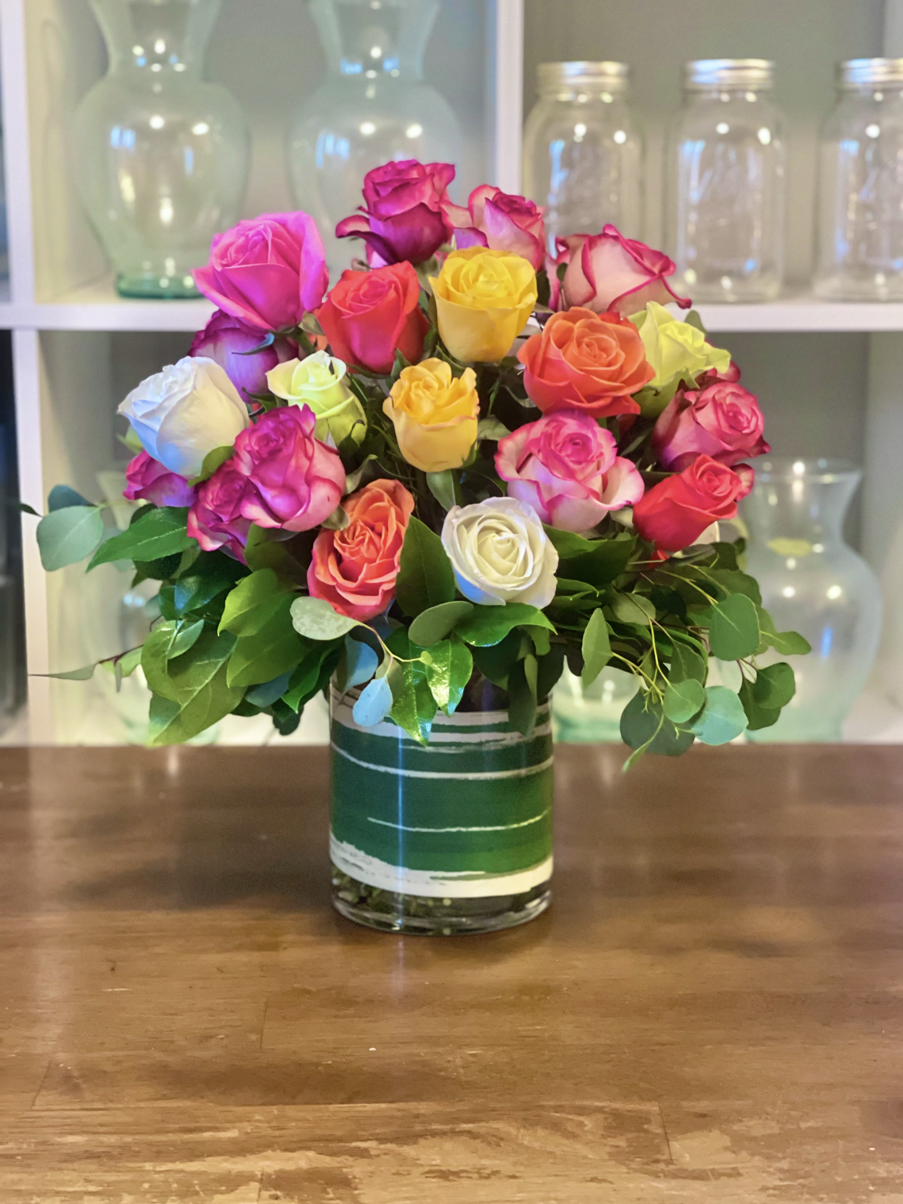 Colorful rose bouquet in a glass vase