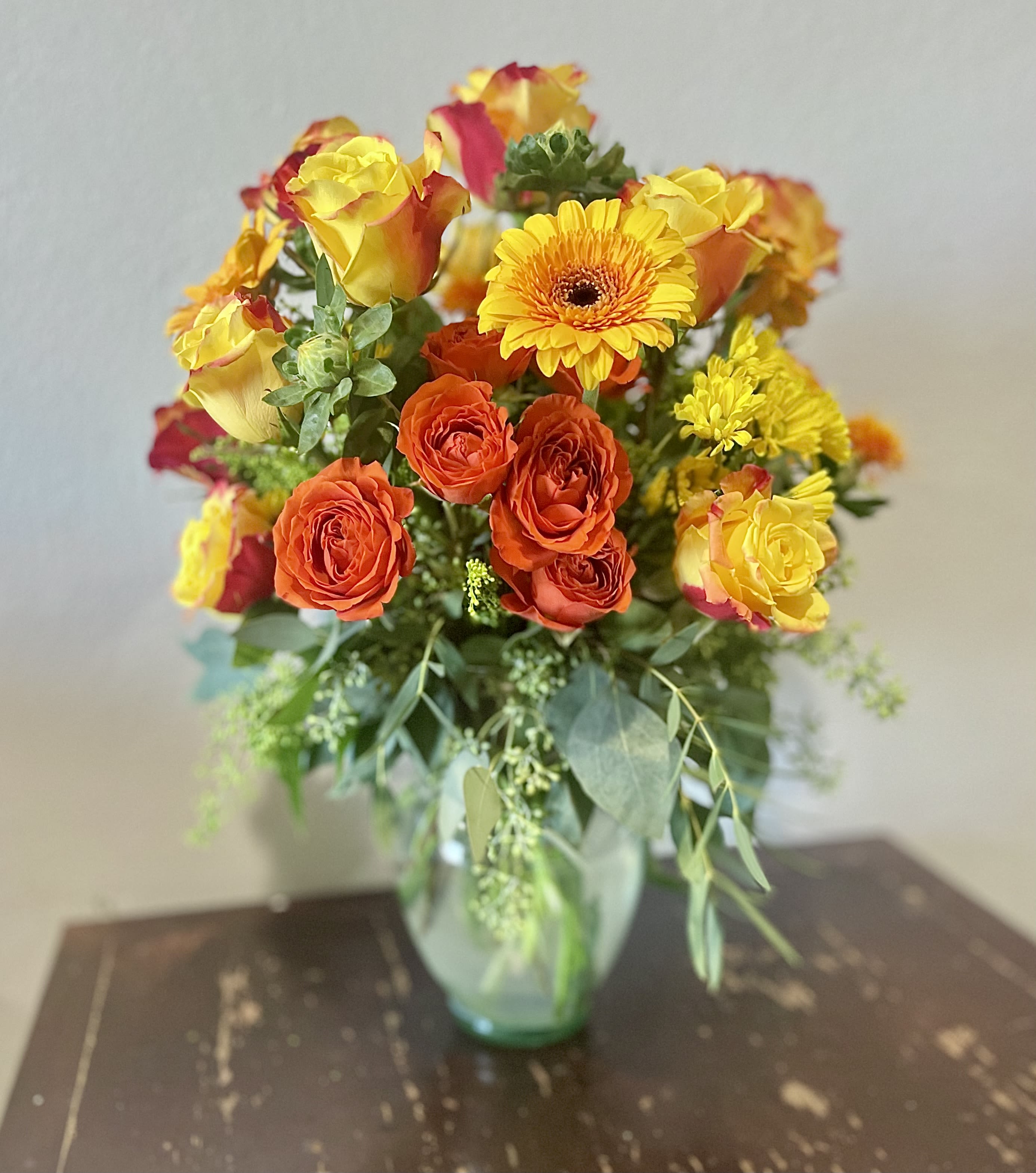 Summer Vibes - Gorgeous and vibrant yellow red and orange hues with a variety of textures come together to make the ultimate summer vibes arrangement. 