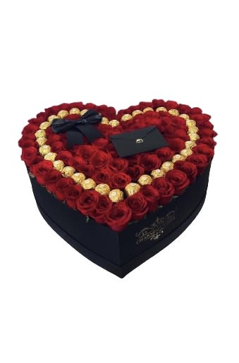 Heart-shaped box filled with red roses and gold chocolates