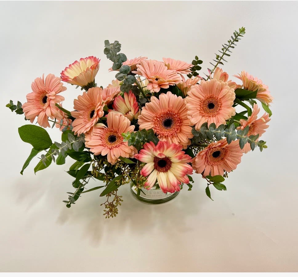 Peach gerbera daisy bouquet in a glass vase