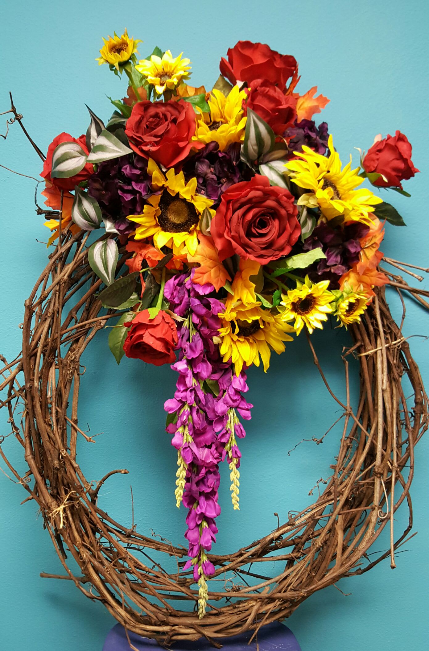 Large Fall Colored Silk Wreath - Large fall colored silks Wreath made with a grapevine wreath. The rich fall colors always attract someone's eye.