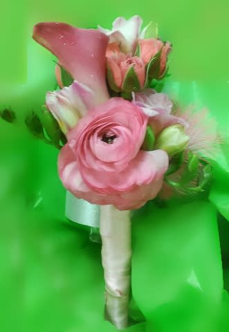Small handheld bouquet of pink flowers with a wrapped handle on a bright green background