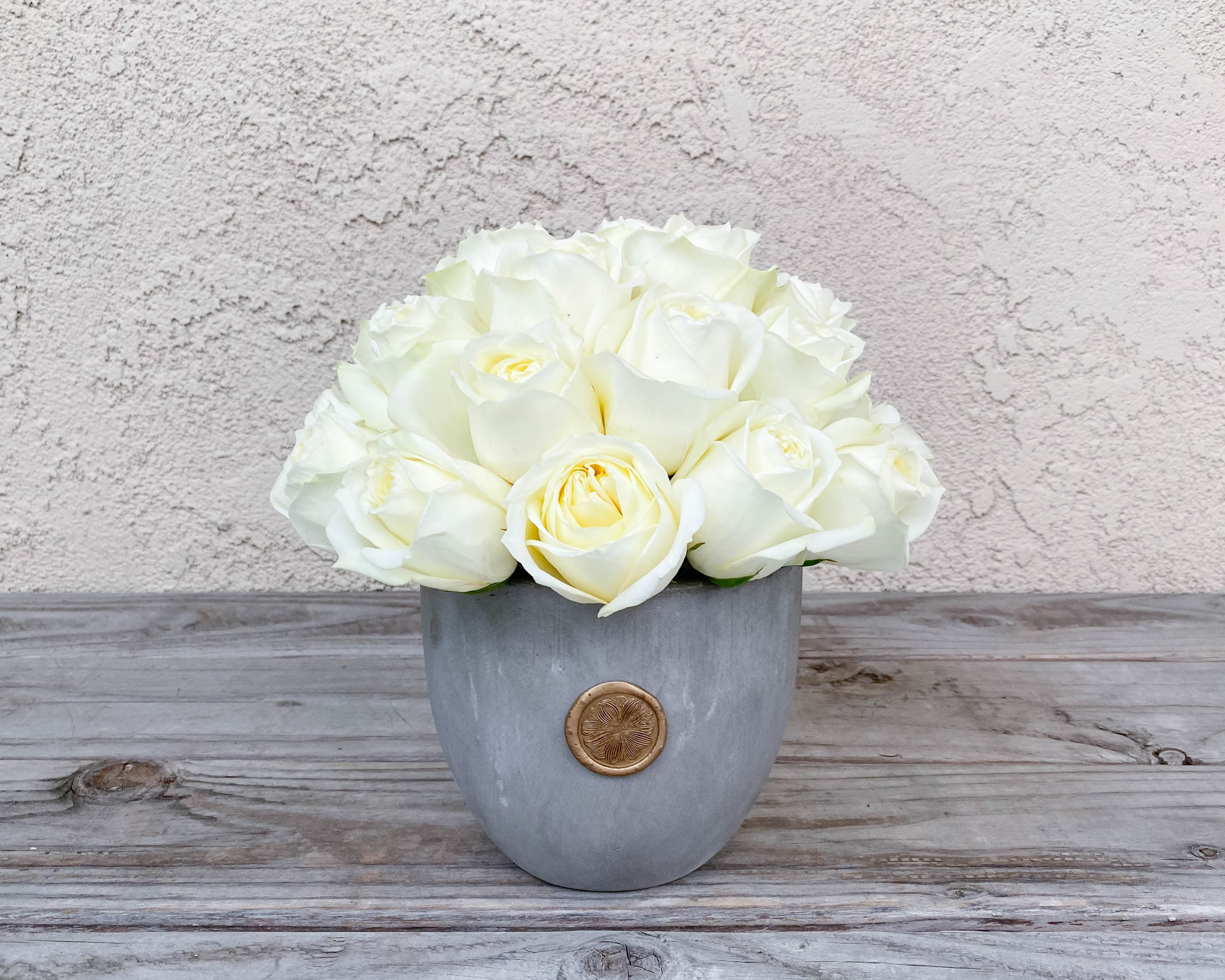 White rose bouquet in a gray vase