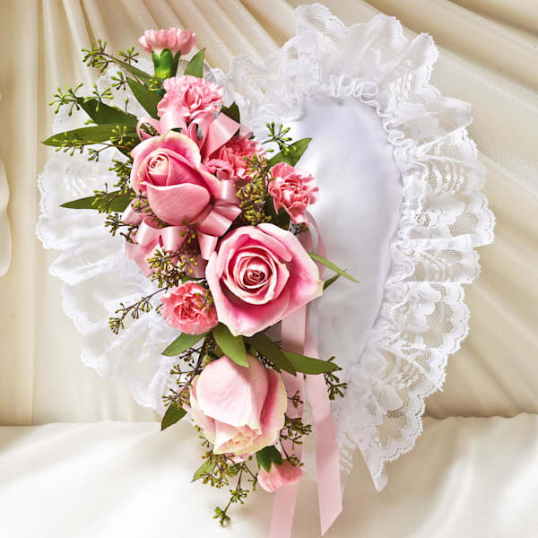 Pink rose corsage with lace trim and ribbon