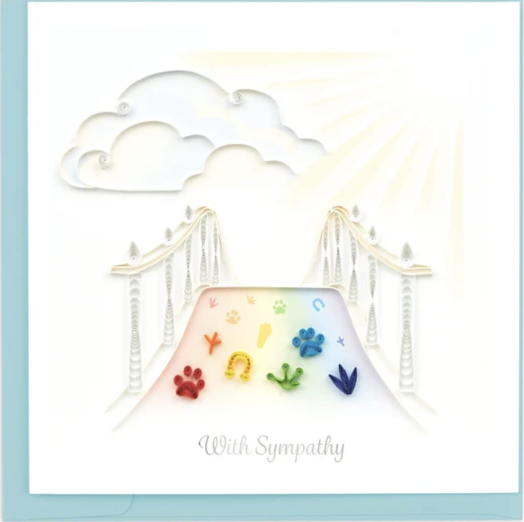 Sympathy card with rainbow paw prints and a bridge under clouds
