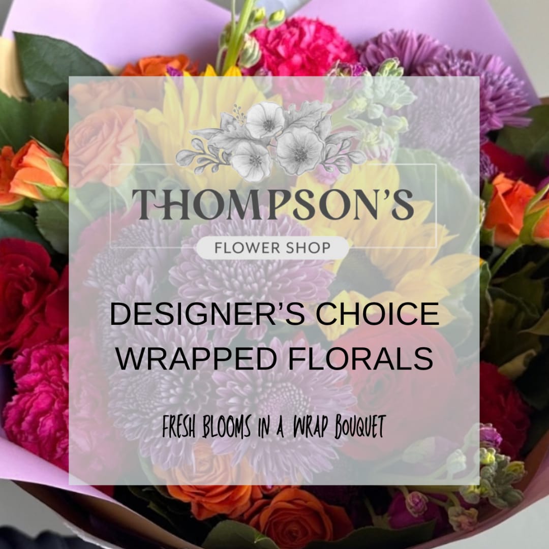 Wrapped bouquet of mixed flowers with a shop label overlay