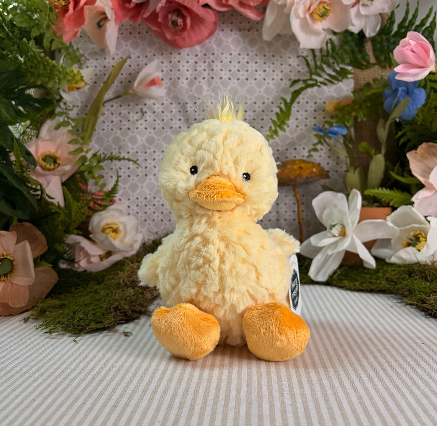 Putty Nursery Yellow Duck - • Soft toy ducky: Putty Duck is a sweet friend with super soft, etched fabric in light yellow; great for little ones to sink their fingers into.  • Measures 11 inches: Duck has embroidered eyes and orange bill and feet.