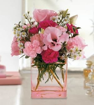 Pink bouquet in a square glass vase