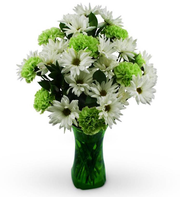 White daisies and green carnations in a green glass vase