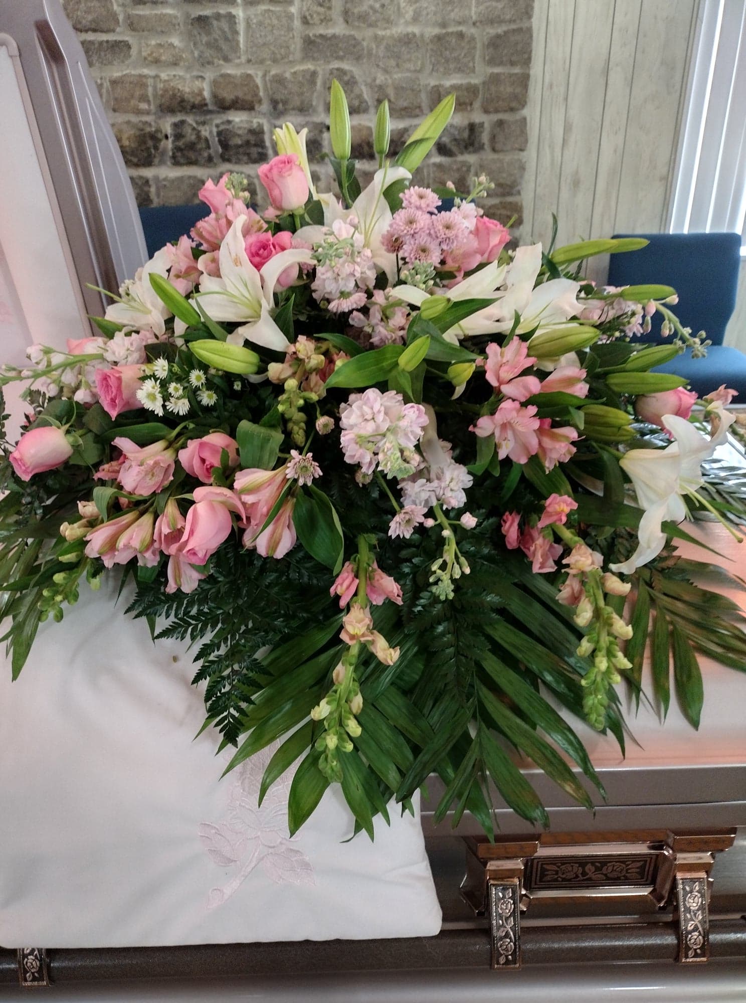 Large pink and white floral spray with lilies and roses