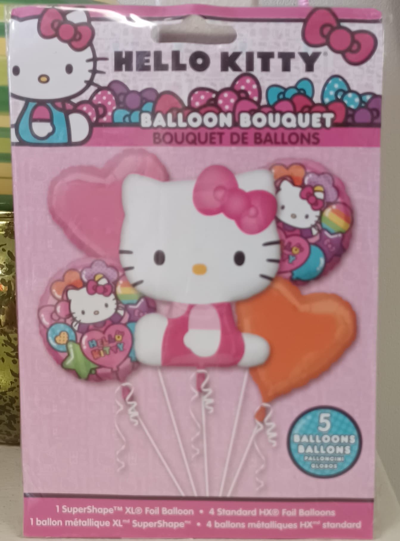 Hello Kitty balloon bouquet package with pink and orange heart balloons
