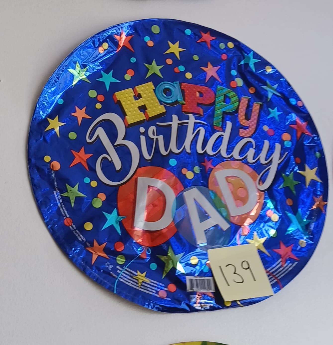 Round blue foil balloon reading Happy Birthday Dad