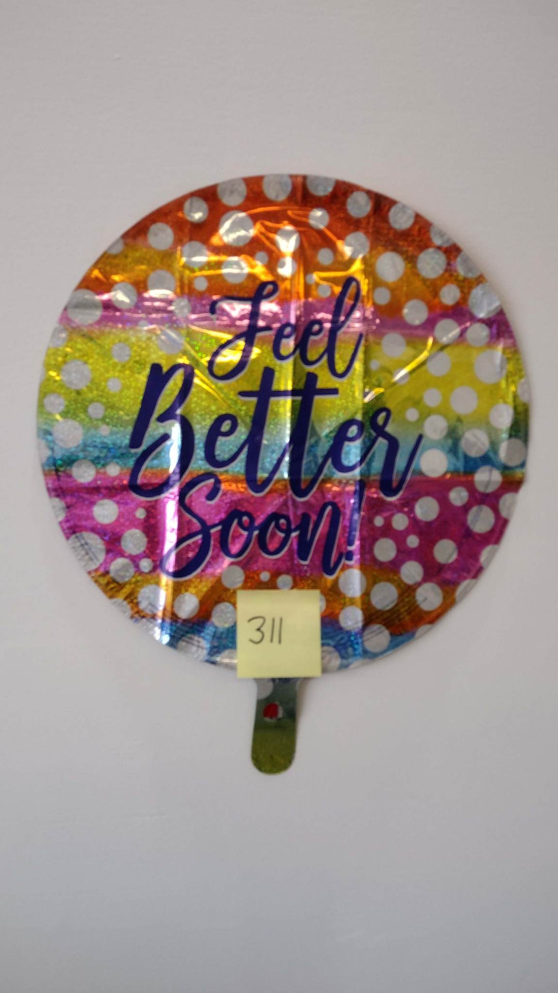 Round foil balloon with "Feel Better Soon" text and polka dots