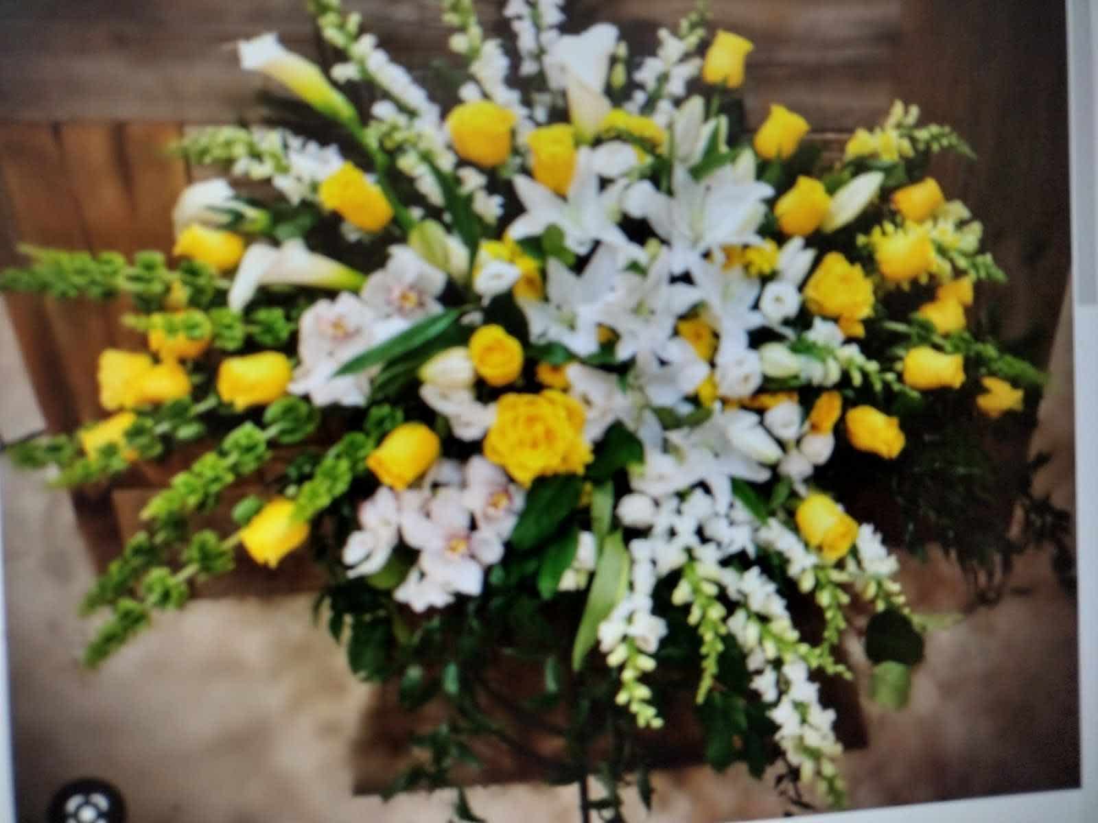 Large white and yellow floral spray with lilies and roses