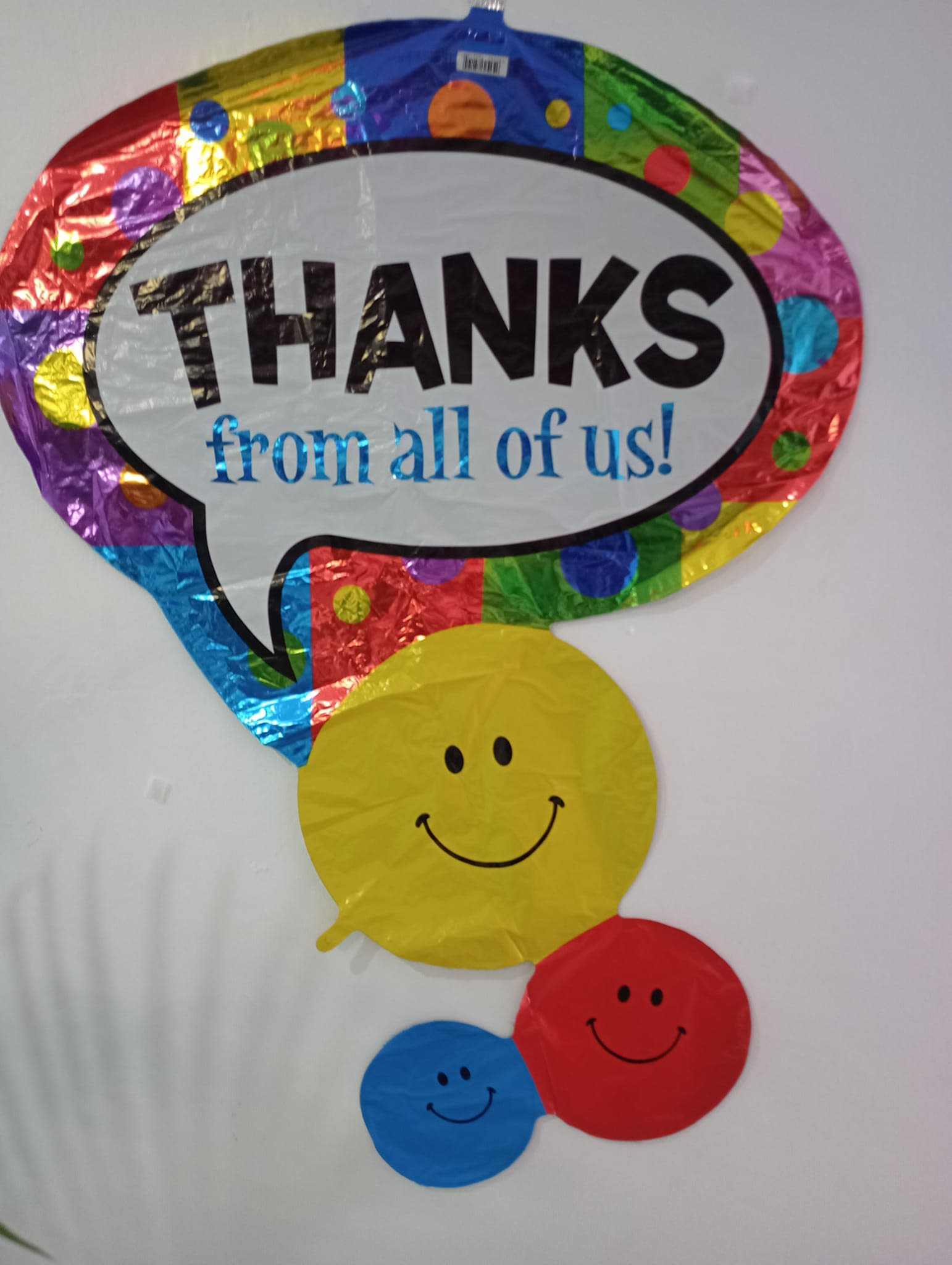 Colorful thank-you balloon with smiley faces
