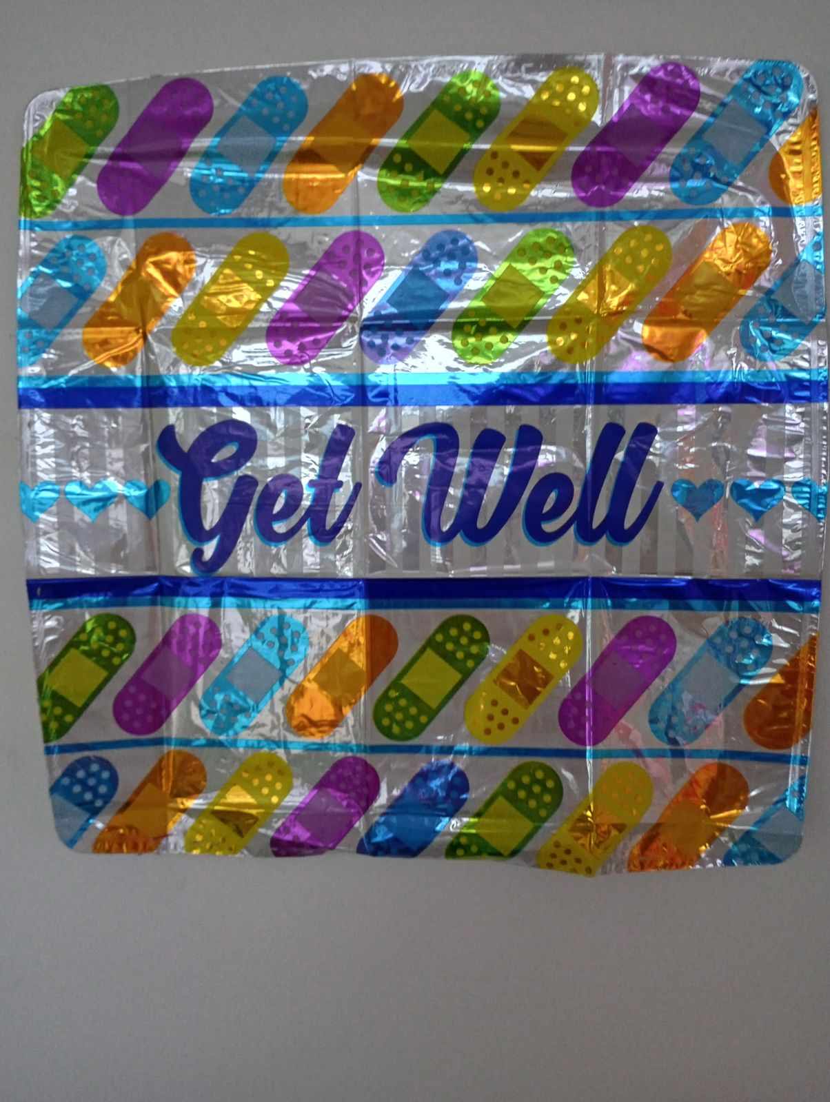Colorful foil get well balloon with pill graphics