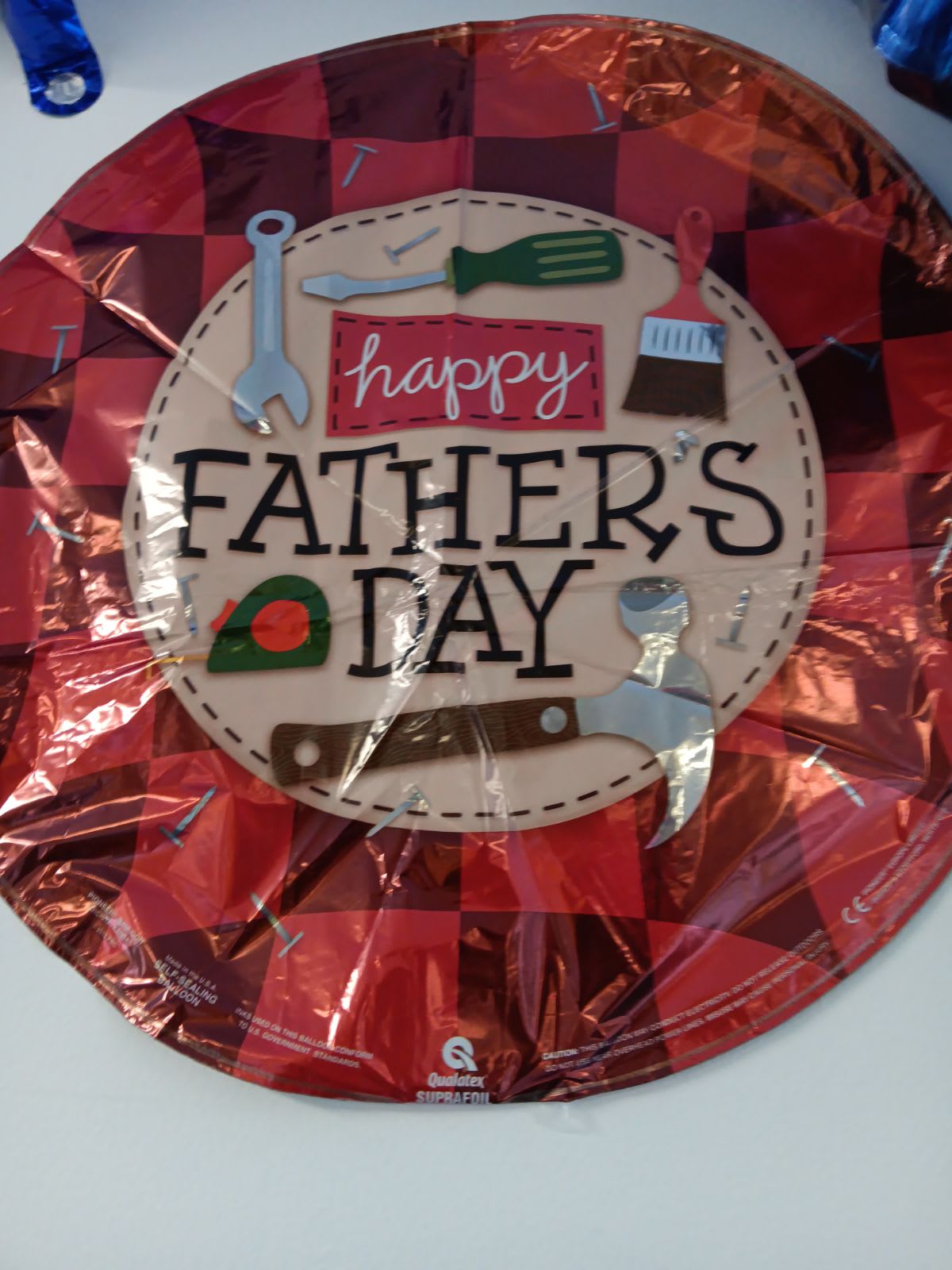 Red Father's Day foil balloon with tool graphics